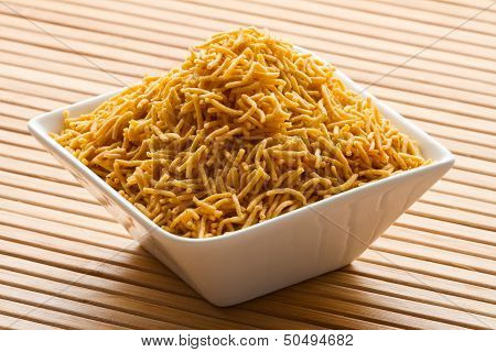 Indian snack in white bowl.