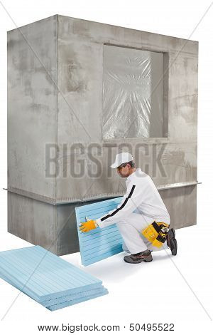 Worker Setting Up An Insulation Panel
