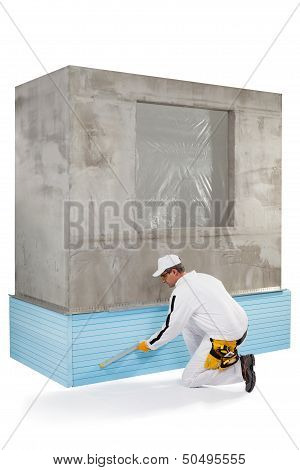 Worker Measuring With A Level Tool