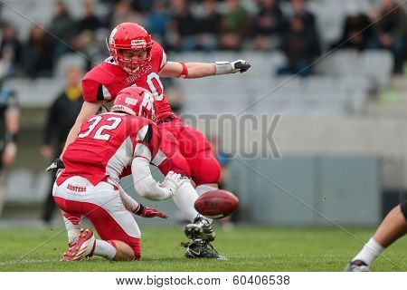 INNSBRUCK,  AUSTRIA - MAY 25 K Ilkka Laitinen (#10 Roosters) kicks the ball during the EFL football game on May 25, 2013 in Innsbruck, Austria.