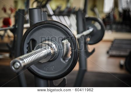 Barbell ready to workout, indooors, shallow DOF