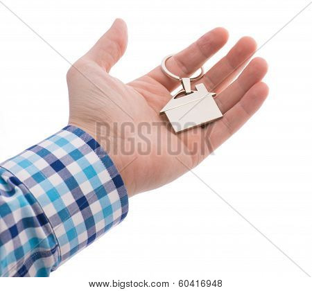 Close-up Of Hand Giving A Key Ring With House Isolated On White Bacground