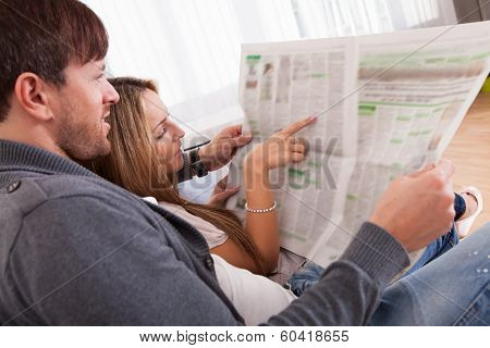 Both Read Article From Newspaper