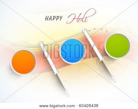 Indian festival Happy Holi celebrations concept with water colours in bucket and pichkari.