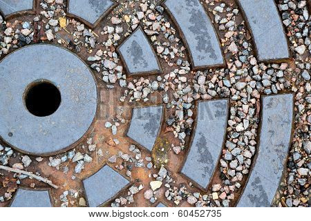metal plate with a pattern and stones