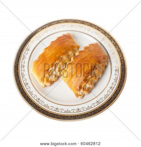 Two pieces of Armenian traditional cake Gata on a plate with ornament isolated over white