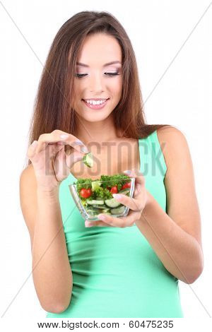 Beautiful girl with fresh salad isolated on white