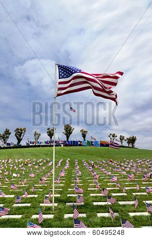 American Flag And Headstones At United States National Cemetery