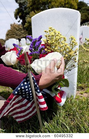American Flag And Headstones At United States National Cemetery