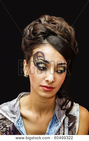beautiful young girl with a make up .