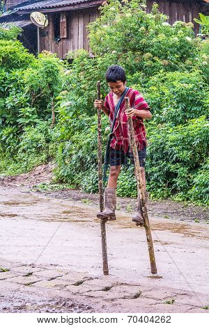 Walking On Wooden Stilts.