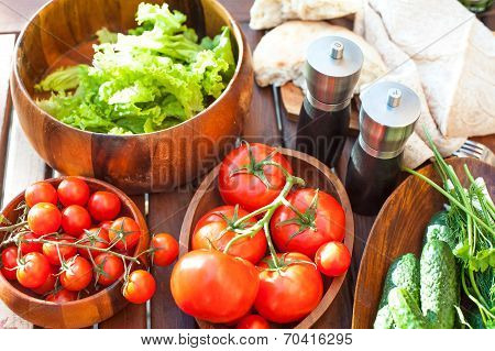 Tomatoes, Salad And Cucumbers-vegetables For Picnic. Outdoors.