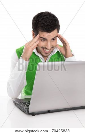 Happy Isolated Man With Computer Looking Amused Or Amazed At The Screen.