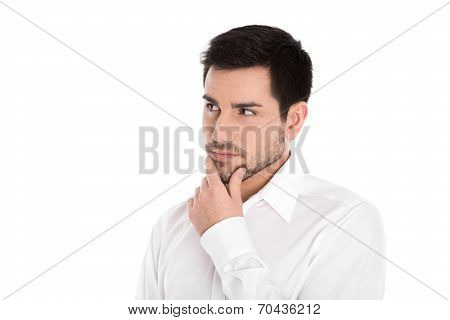 Serious And Pensive Isolated Young Businessman Looking Sideways.