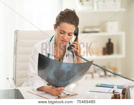 Doctor Woman With Fluorography Talking Phone