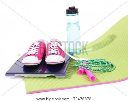 Sport requisites on a carpet isolated on white