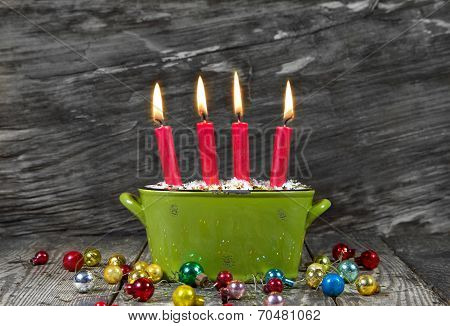 Four Red Christmas Candles - Traditonel In Green And Red - Decoration Advent On A Old Wooden Backgro