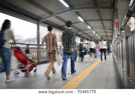 people on pedestrain bridge