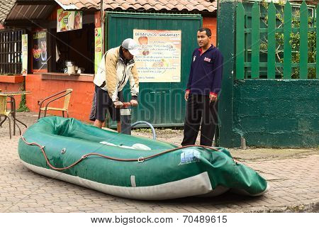 Inflating a Boat in Banos, Ecuador