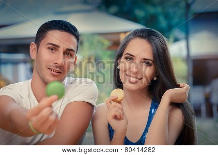 Cute Couple Having Macarons at a Restaurant