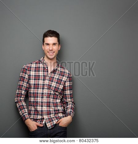 Charming Young Man In Checkered Shirt Smiling