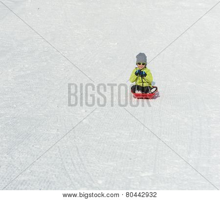 Boy On Sledge