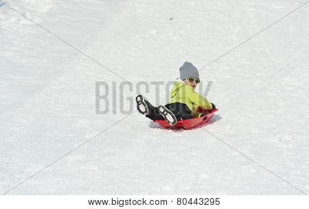 Boy On Sledge