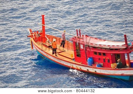 Fishing boat heading out to the gulf in the early morning