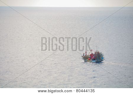 Fishing boat heading out to the gulf in the early morning