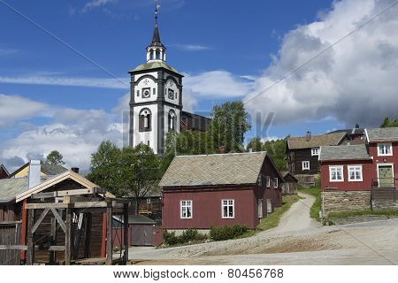 Traditional houses and church bell tower exterior of the copper mines town of Roros Norway.