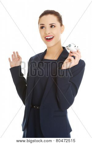 Young businesswoman with plane toy in hand