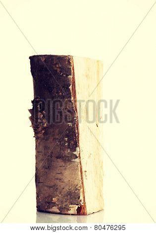 One separated piece of light wood. 