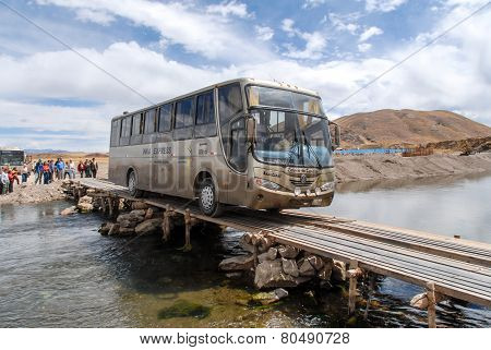 Tourist Bus Crossing River - Ayaviri, Peru