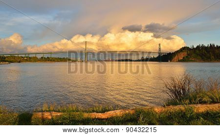 Lions Gate Bridge And Downtown Vancouver With Spectacular Clouds At Sunset