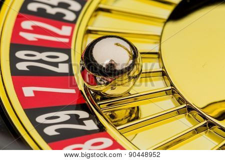the cylinder of a roulette gambling in a casino. winning or losing is decided by chance.