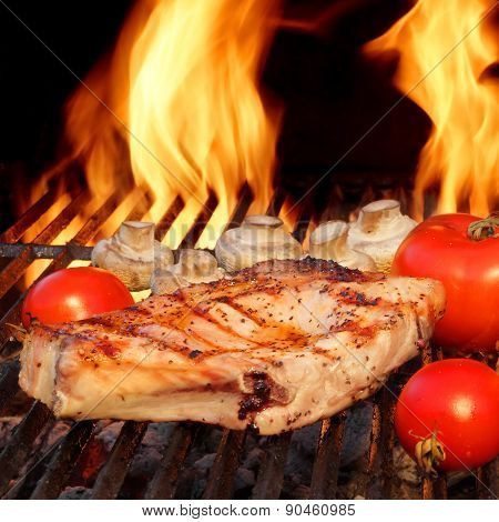 Pork Rib Steaks, Tomato And Mushrooms On Hot Bbq Grill