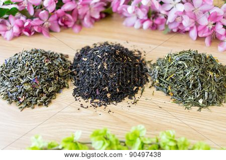 Three Found Teas On A Table.