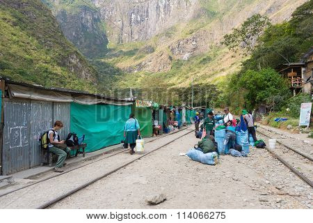 People And Baggages On Railway Track To Machu Picchu, Peru