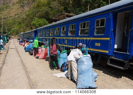 People And Baggages On Railway Track To Machu Picchu, Peru