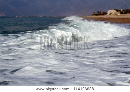 Foaming Waves Of The Sea Lapping On The Shore.