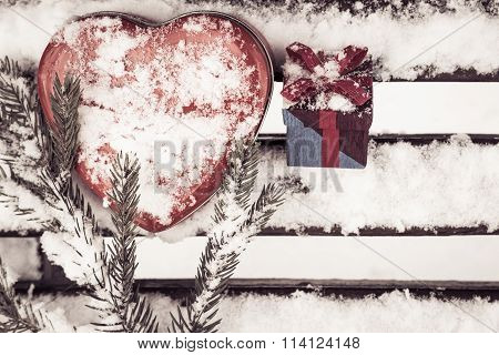 Red Heart Shaped Tin Box With A Gift Box And A Fragment Of A Pine-tree Branch