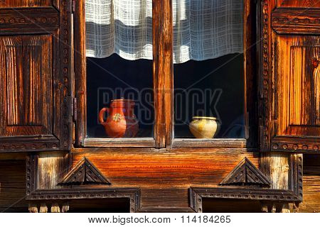 Open window with a wooden sun blind.