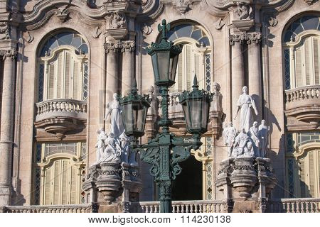 Detail of Lorca Theater building facade with statue in Havana, Cuba
