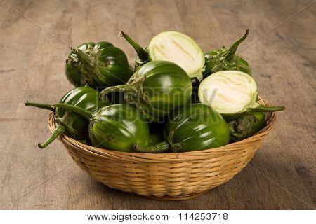 Some Green African Eggplants Over A Wooden Surface