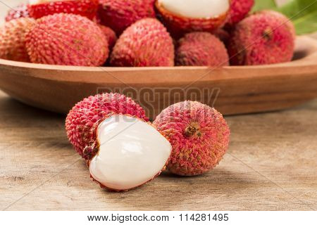 Fresh Lychees On Wooden Surface.