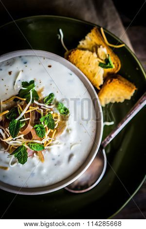 Cream Soup With Bread And Meat On Wooden Background