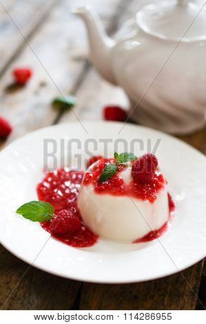 Delicious Italian Dessert Panna Cotta With Raspberry Sauce And Mint On White Background