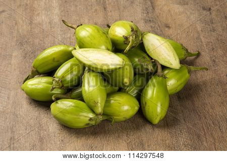 Some Green African Eggplants Over A Wooden Surface