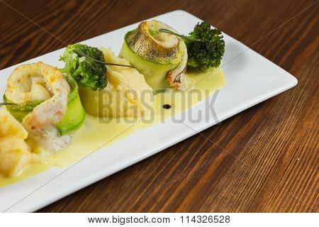 Fish with vegetables. Beautiful layout on a plate