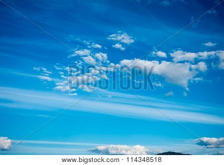 field against a blue sky  blur